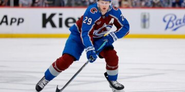 Apr 21, 2026; Denver, Colorado, USA; Colorado Avalanche center Nathan MacKinnon (29) controls the puck in the second period against the Los Angeles Kings in game two of the first round of the 2026 Stanley Cup Playoffs at Ball Arena. Mandatory Credit: Isaiah J. Downing-Imagn Images