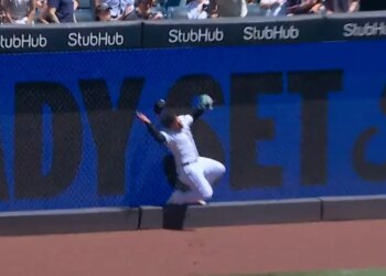 Yankees outfielder Jasson Dominguez crashes into the wall making a catch in the first inning on May 7, 2026.