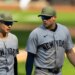New York Yankees players Anthony Volpe and Max Schuemann walking off the field after a loss.