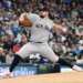 New York Yankees starting pitcher Carlos Rodon (55) throws a pitch in the first inning against the Milwaukee Brewers at American Family Field.