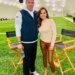 Mike Vrabel and reporter Dianna Russini standing together on an indoor football field.