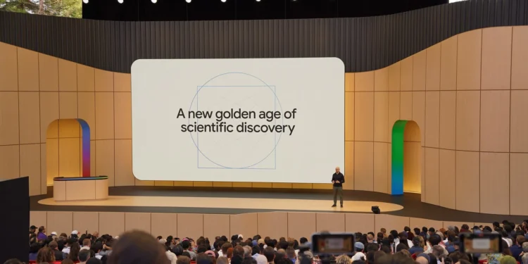 A picture of Demis Hassabis onstage at Google I/O 2026 with the screen behind him saying “A new golden age of scientific discovery”