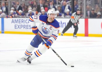 FILE - Edmonton Oilers center Connor McDavid moves the puck during the first period of an NHL hockey game against the Los Angeles Kings April 11, 2026 in Los Angeles. (AP Photo/Ryan Sun, File)