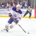 FILE - Edmonton Oilers center Connor McDavid moves the puck during the first period of an NHL hockey game against the Los Angeles Kings April 11, 2026 in Los Angeles. (AP Photo/Ryan Sun, File)