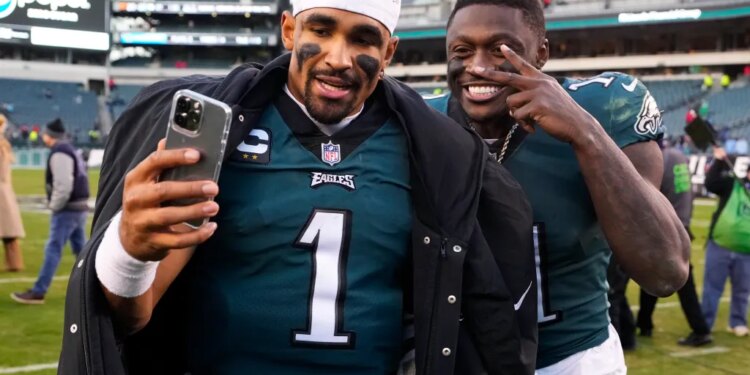 Philadelphia Eagles' Jalen Hurts and A.J. Brown pose for a photo.