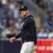 New York Yankees manager Aaron Boone reacts as he walks back to the dugout.