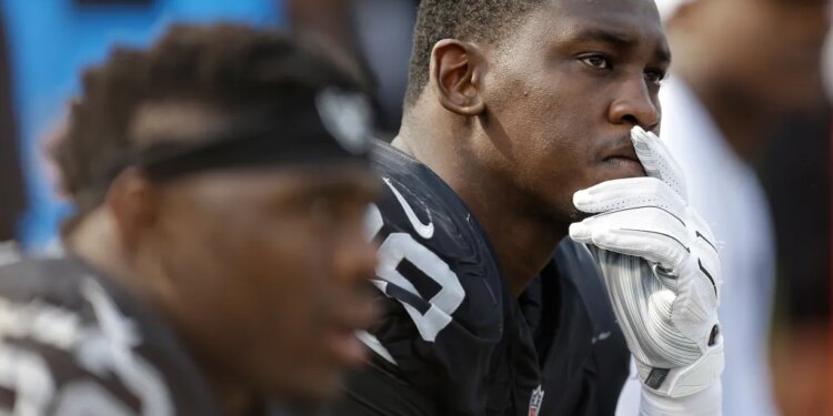 Oakland Raiders linebacker Aldon Smith sits on the bench.