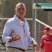 John Mozeliak, President of Baseball Operations for the St. Louis Cardinals, tossing a baseball.