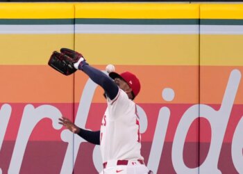 Los Angeles Angels right fielder Jo Adell misplays a ball hit by Colorado Rockies' TJ Rumfield that hit him in the head and then bounced out for a solo home run during the fourth inning of a baseball game Tuesday, June 2, 2026, in Anaheim, Calif.