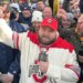 Big Ev from Barstool Sports speaking into a microphone, surrounded by a crowd.