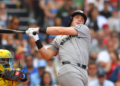 New York Yankees' Ben Rice, right, strikes out swinging in front of Boston Red Sox catcher Carlos Narváez, left, in the ninth inning of a baseball game, Saturday, June 27, 2026, in Boston.
