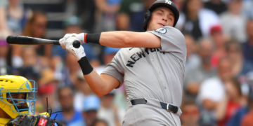 New York Yankees' Ben Rice, right, strikes out swinging in front of Boston Red Sox catcher Carlos Narváez, left, in the ninth inning of a baseball game, Saturday, June 27, 2026, in Boston.