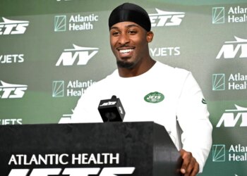 A smiling Breece Hall talks to reporters during Jets minicamp on June 16, 2026.
