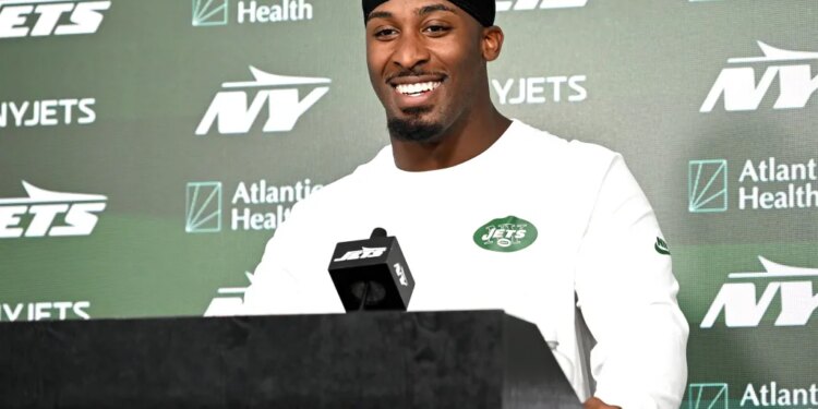A smiling Breece Hall talks to reporters during Jets minicamp on June 16, 2026.