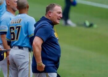 Milwaukee Brewers manager Pat Murphy on the field during the national anthem.