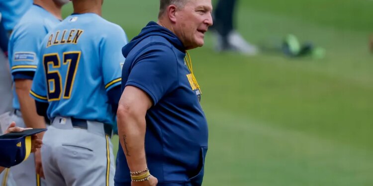 Milwaukee Brewers manager Pat Murphy on the field during the national anthem.