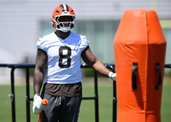 Cleveland Browns defensive end Jared Verse stands on the field during practice.