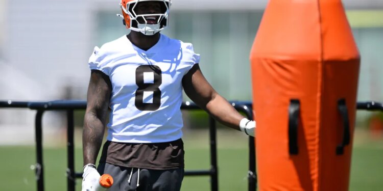Cleveland Browns defensive end Jared Verse stands on the field during practice.
