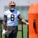 Cleveland Browns defensive end Jared Verse stands on the field during practice.