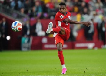 Jiovany Ramos of Panama kicking a soccer ball during a World Cup match.