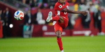 Jiovany Ramos of Panama kicking a soccer ball during a World Cup match.