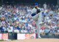 Chicago Cubs' David Peterson in his pitching motion on the mound.
