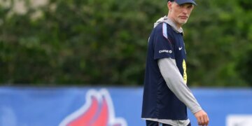 England head coach Thomas Tuchel walks on a field during practice.