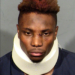 Booking photo of former Las Vegas Raiders wide receiver Henry Ruggs III wearing a neck brace.