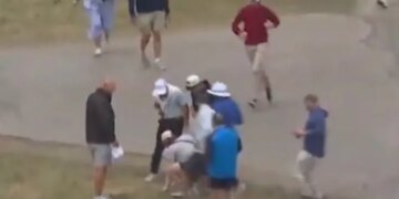 A fan picks up Rory McIlroy's ball after a shot on the fourth hole during the first round of the U.S. Open on June 18, 2026.
