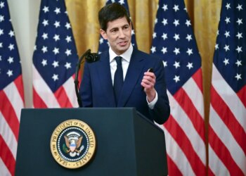 Kevin Warsh, sworn in as Federal Reserve Chair, speaks at a podium with the Seal of the President of the United States.