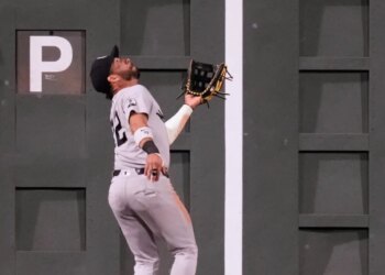 New York Yankees' José Caballero catches a flyout hit by Boston Red Sox's Wilyer Abreu during the seventh inning of a baseball game, Thursday, June 25, 2026, in Boston.