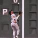 New York Yankees' José Caballero catches a flyout hit by Boston Red Sox's Wilyer Abreu during the seventh inning of a baseball game, Thursday, June 25, 2026, in Boston.