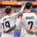 Germany's Leroy Sane and Kai Havertz celebrate after scoring the seventh goal during a World Cup Group E soccer match.