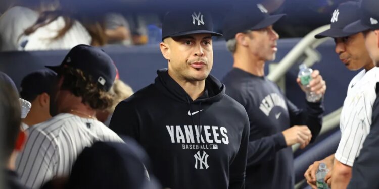 Giancarlo Stanton of the New York Yankees in the dugout.
