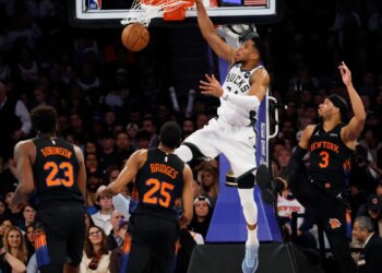 Giannis Antetokounmpo of the Milwaukee Bucks slams the ball.