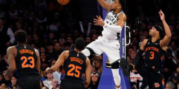 Giannis Antetokounmpo of the Milwaukee Bucks slams the ball.
