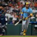 Jackson Chourio of the Milwaukee Brewers runs after hitting a fly out.