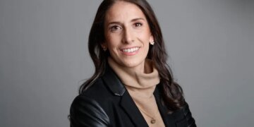 Gotham FC General Manager Yael Averbuch West smiles at the camera.