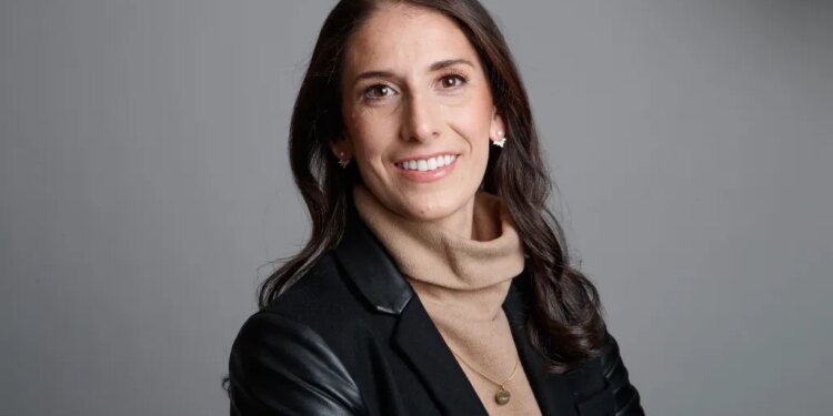 Gotham FC General Manager Yael Averbuch West smiles at the camera.