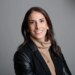 Gotham FC General Manager Yael Averbuch West smiles at the camera.