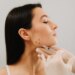 A woman receiving botulinum toxin injections for bruxism treatment.