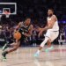 San Antonio Spurs guard De'Aaron Fox drives the ball downcourt as New York Knicks guard Mikal Bridges gives chase during Game 3 of the NBA Finals.