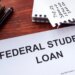 Federal student loan form on a table.