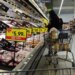 Shoppers at a grocery store stocking up on meat and other supplies before a winter storm.