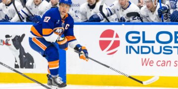 New York Islanders left wing Anders Lee (27) skates with the puck during a game against the Toronto Maple Leafs.