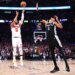 Jalen Brunson #11 sinks a three-point shot over San Antonio Spurs forward Victor Wembanyama #1 to bring the Knicks within one during the fourth quarter.