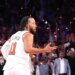 Jalen Brunson #11 reacts after he sinks a three-point shot over San Antonio Spurs forward Victor Wembanyama #1 to bring the Knicks within one during the fourth quarter.