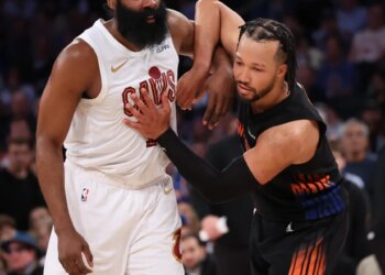 Cleveland Cavaliers guard James Harden and New York Knicks guard Jalen Brunson battle for position.