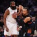 Cleveland Cavaliers guard James Harden and New York Knicks guard Jalen Brunson battle for position.