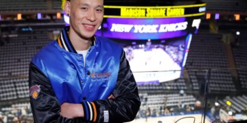 Jeremy Lin posing in a New York Knicks jacket before game 3 of the 2026 NBA Finals.